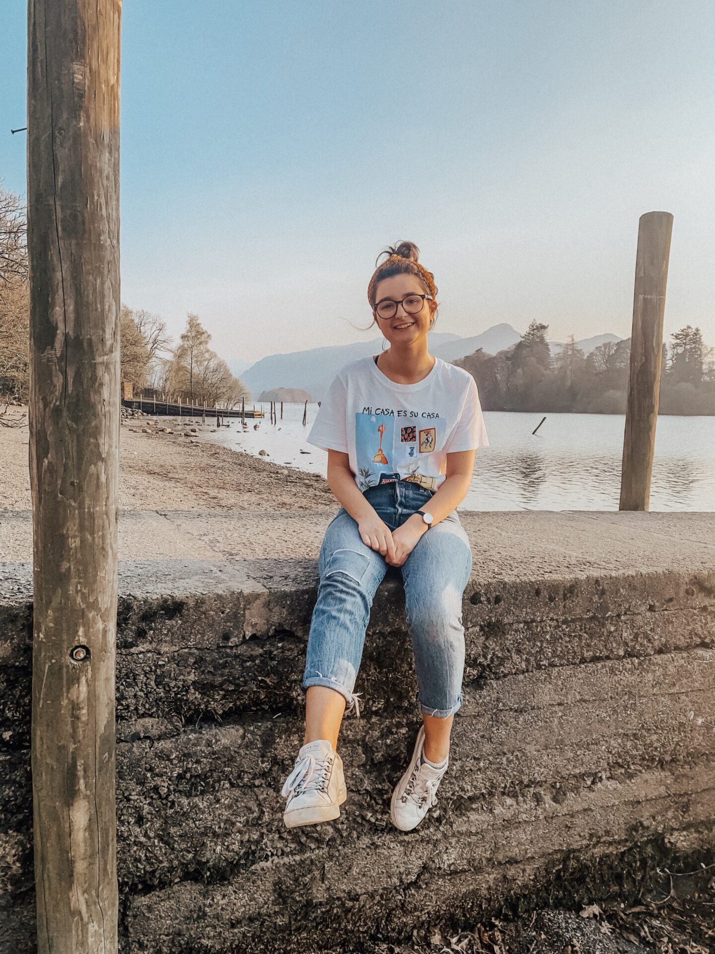 InvisiYouth announcement | girl sitting by Lake Derwentwater