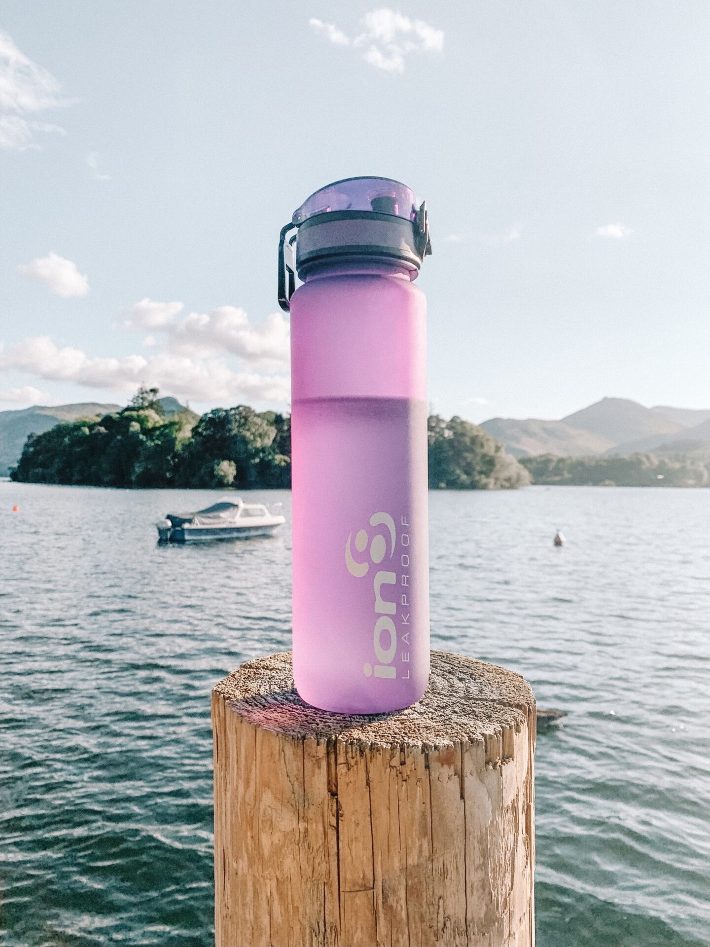 How to keep yourself hydrated with a stoma | The purple 1 litre ion8 Leakproof water bottle with Derwenwater behind