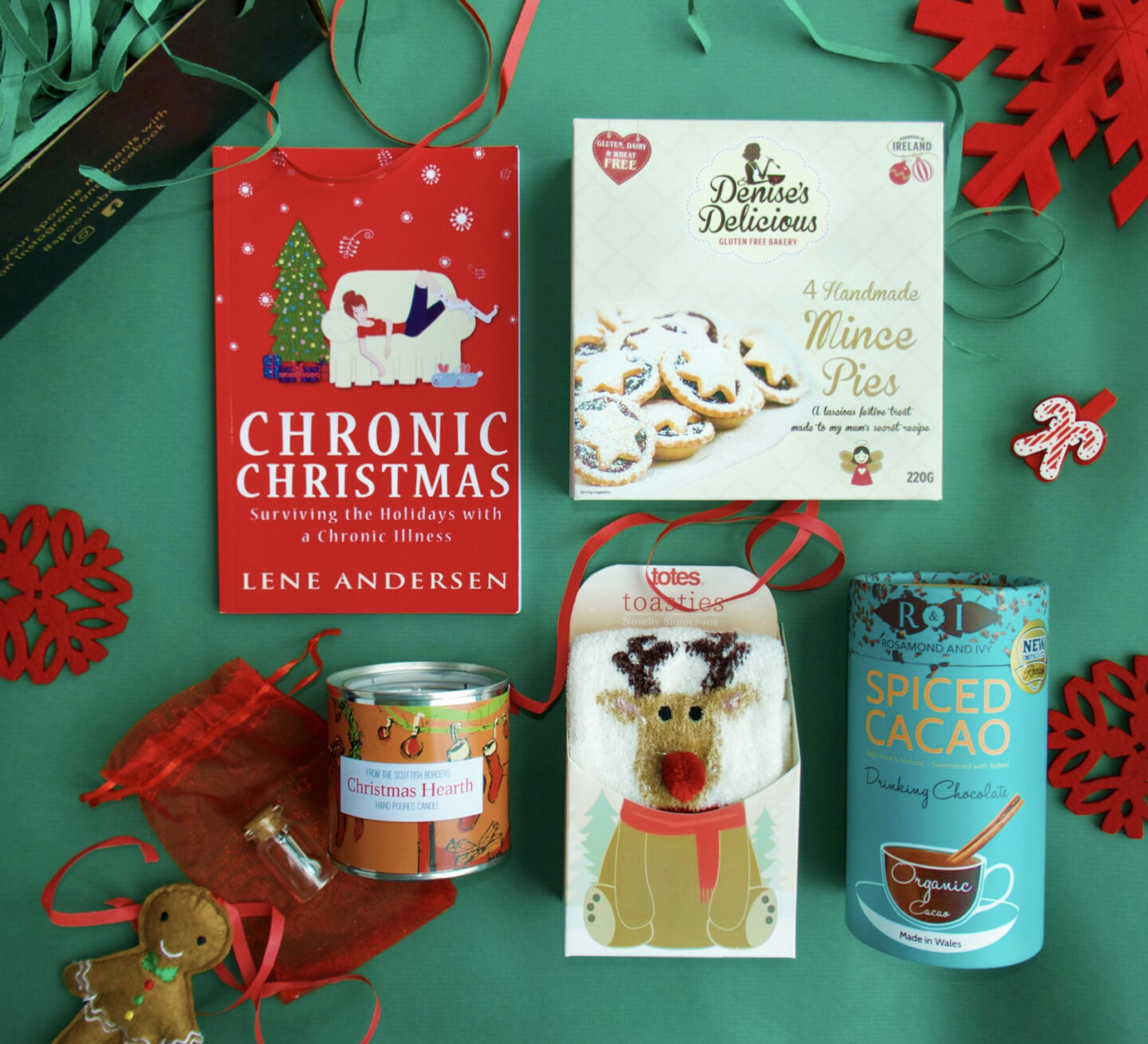contents of the Christmas Spoonie box on a green background | The Chronically Living Gift Guide