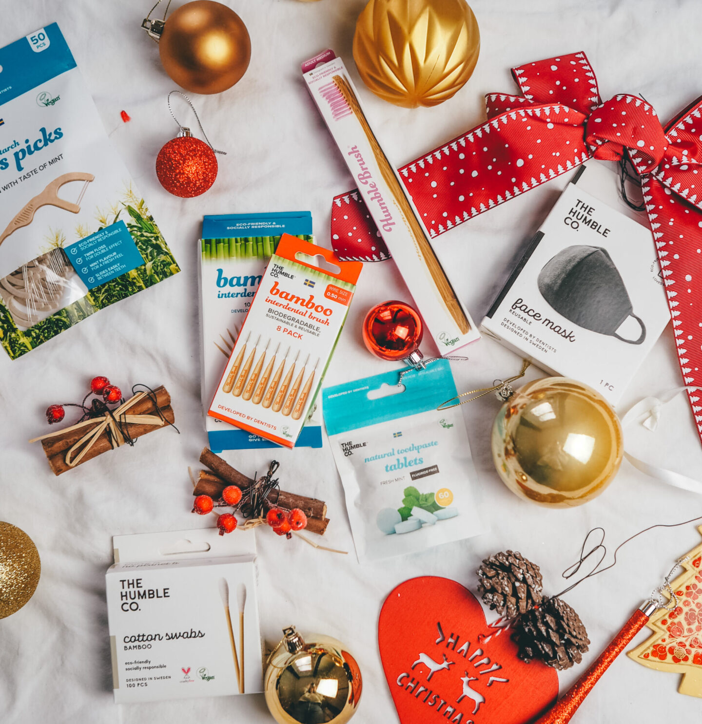 The Humble Co Christmas flatly featuring bamboo tooth picks, tooth brush, natural toothpaste tablets and face mask | Sustainable Stocking Fillers under £15