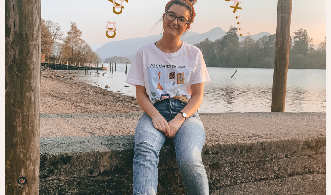 Postcard with Katie May sat by a lake with the words "a digital detox..." in pink over her head
