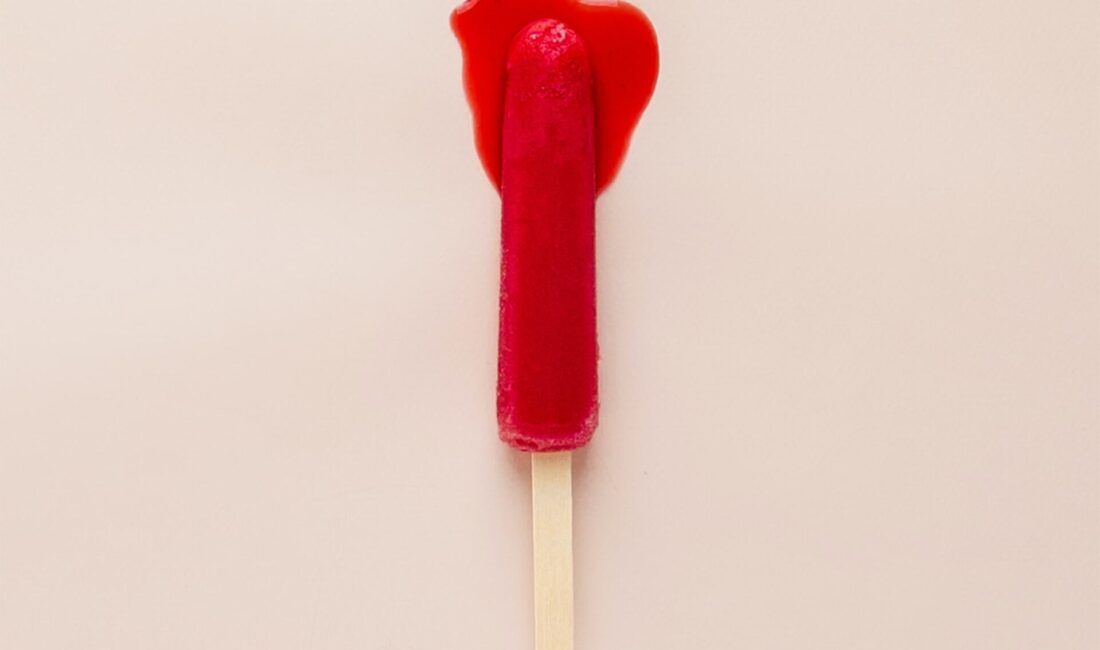 Smear tests explained : pink background with lolly pop which looks like a bleeding tampon