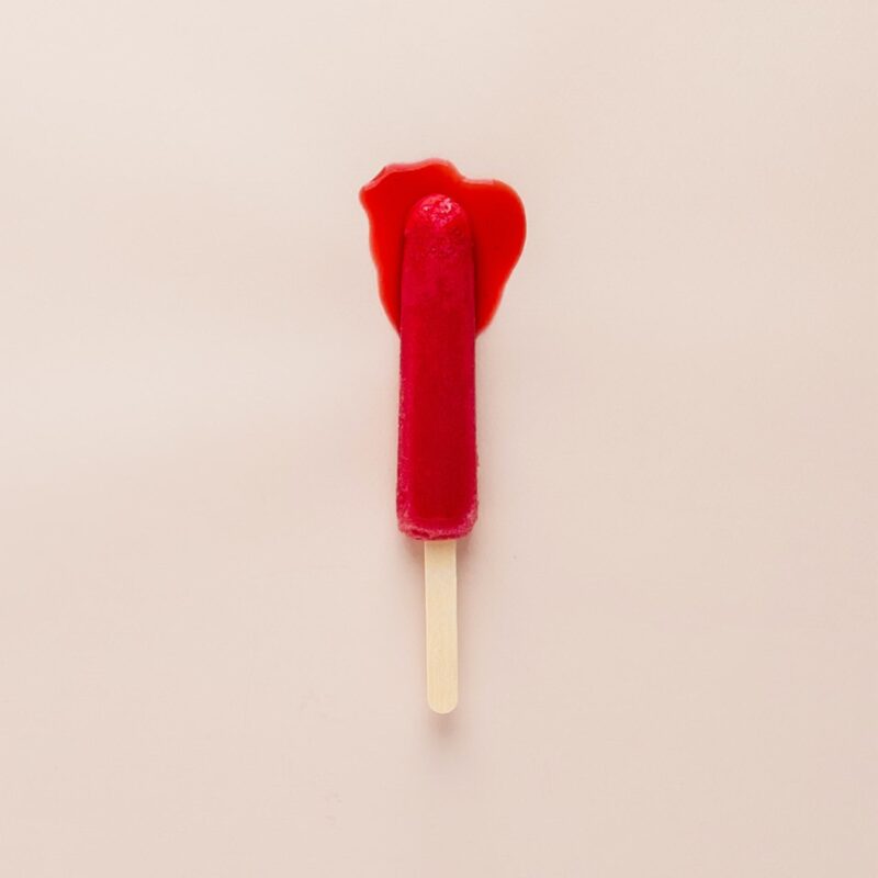 Smear tests explained : pink background with lolly pop which looks like a bleeding tampon